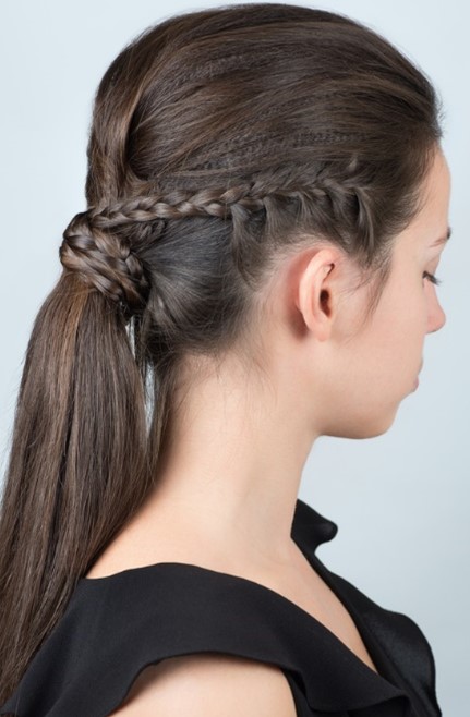 Side profile of a woman with french braid ponytail