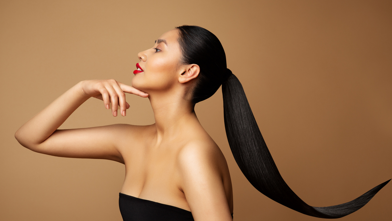 Image of a beautiful woman with high slick back ponytail
