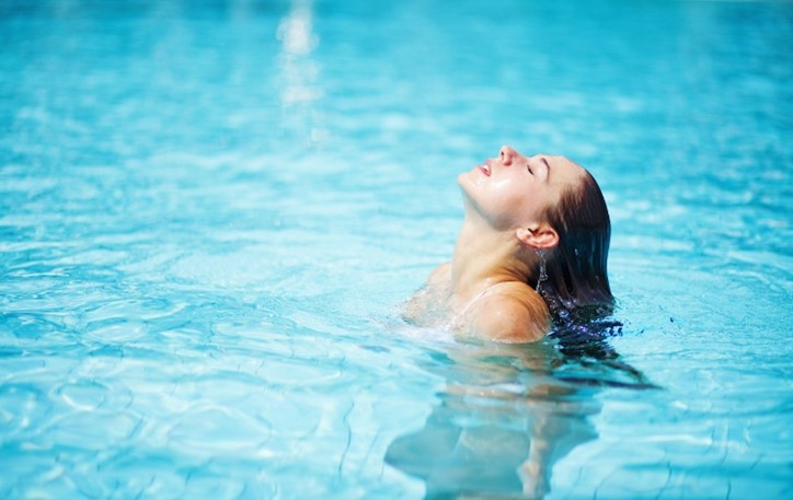 A person swimming in a pool